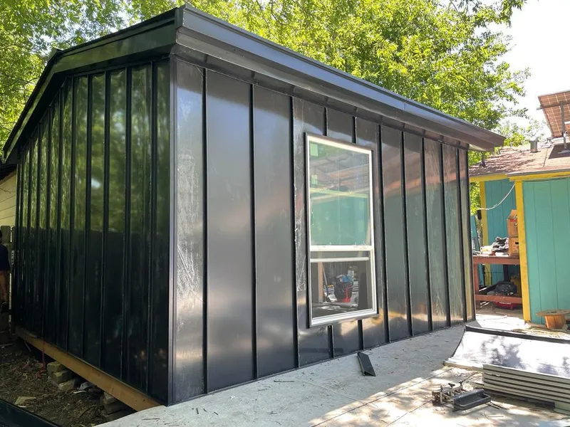 Black standing seam metal wall panels for Roof Inspection in Overland