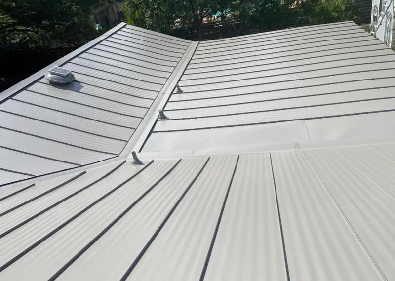 Solar attic fan installed on a metal roof for Roof Ventilation in Overland